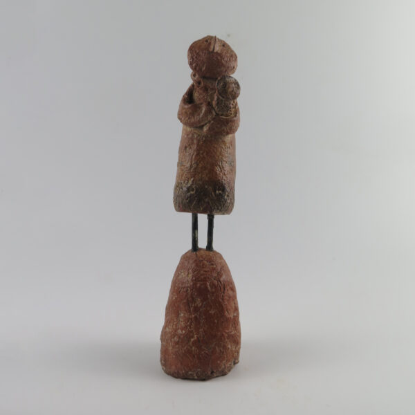 Figure holding an Owl